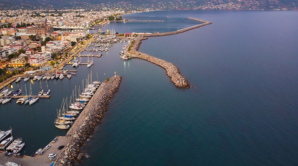 Aerial view of Kalamata marina with luxury yachts in line at dusk