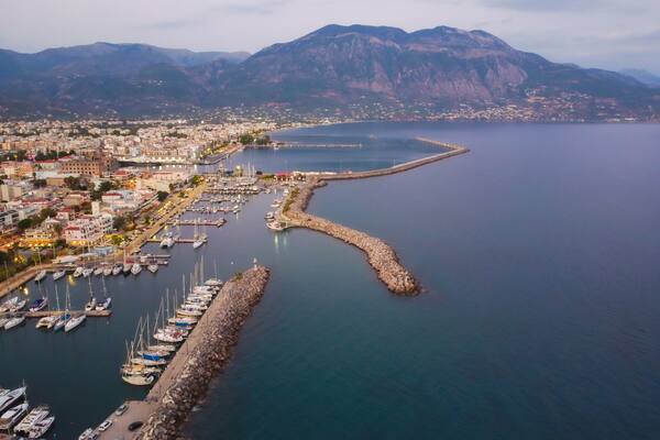 Aerial view of Kalamata marina with luxury yachts in line at dusk