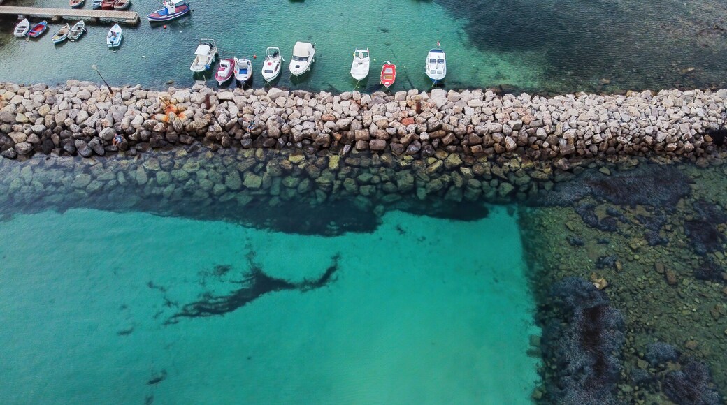 Aerial view of Methoni marina with fishing boats in line