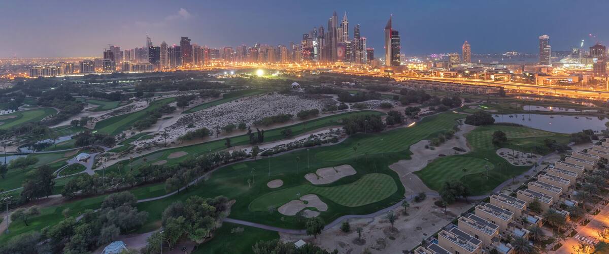 Dubai Marina skyscrapers and golf course night to day timelapse, Dubai, United Arab Emirates