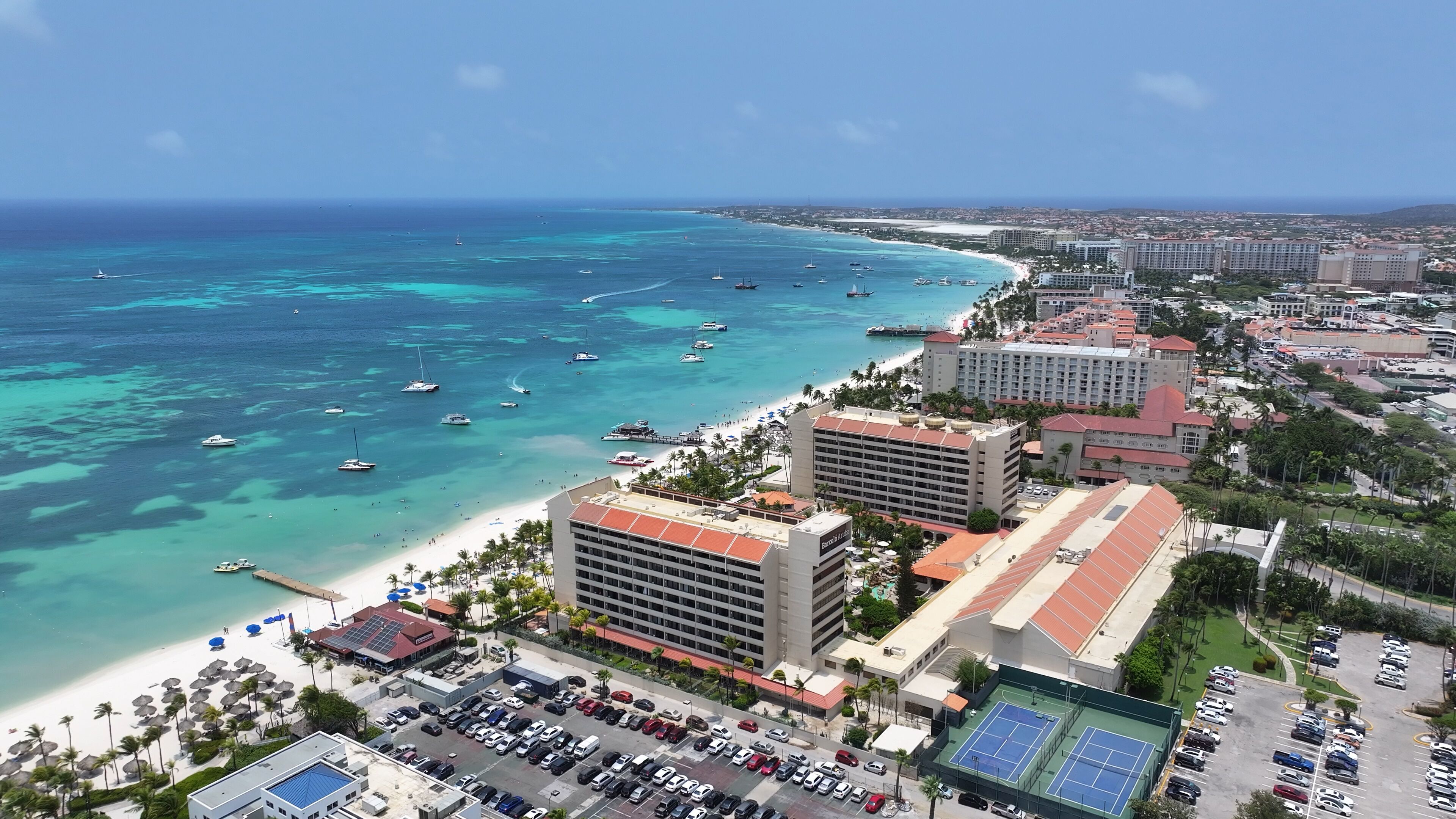 Palm Beach In Noord Oranjestad Aruba. Aerial View Of Stunning Beach With Crystal Clear Waters. Coast Horizon Seaside Summertime. Coast Outdoors Panoramic. Noord Oranjestad.