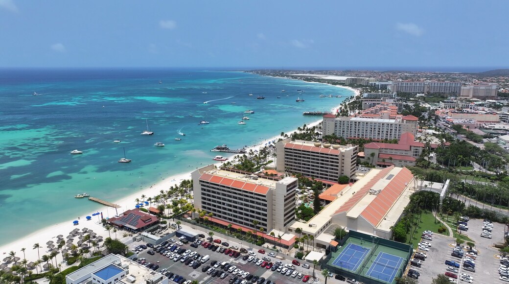 Palm Beach In Noord Oranjestad Aruba. Aerial View Of Stunning Beach With Crystal Clear Waters. Coast Horizon Seaside Summertime. Coast Outdoors Panoramic. Noord Oranjestad.