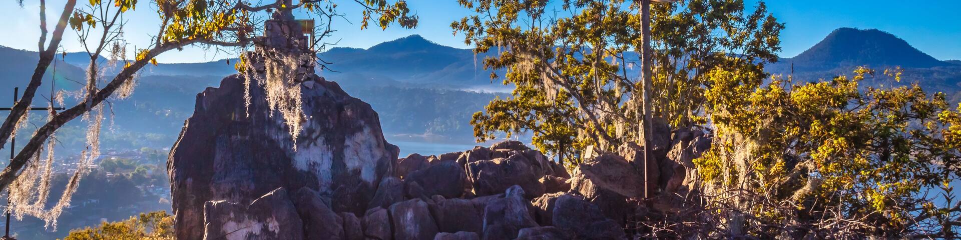 Catholic cross with town and lake in the background in La Peña de Valle de Bravo state of Mexico