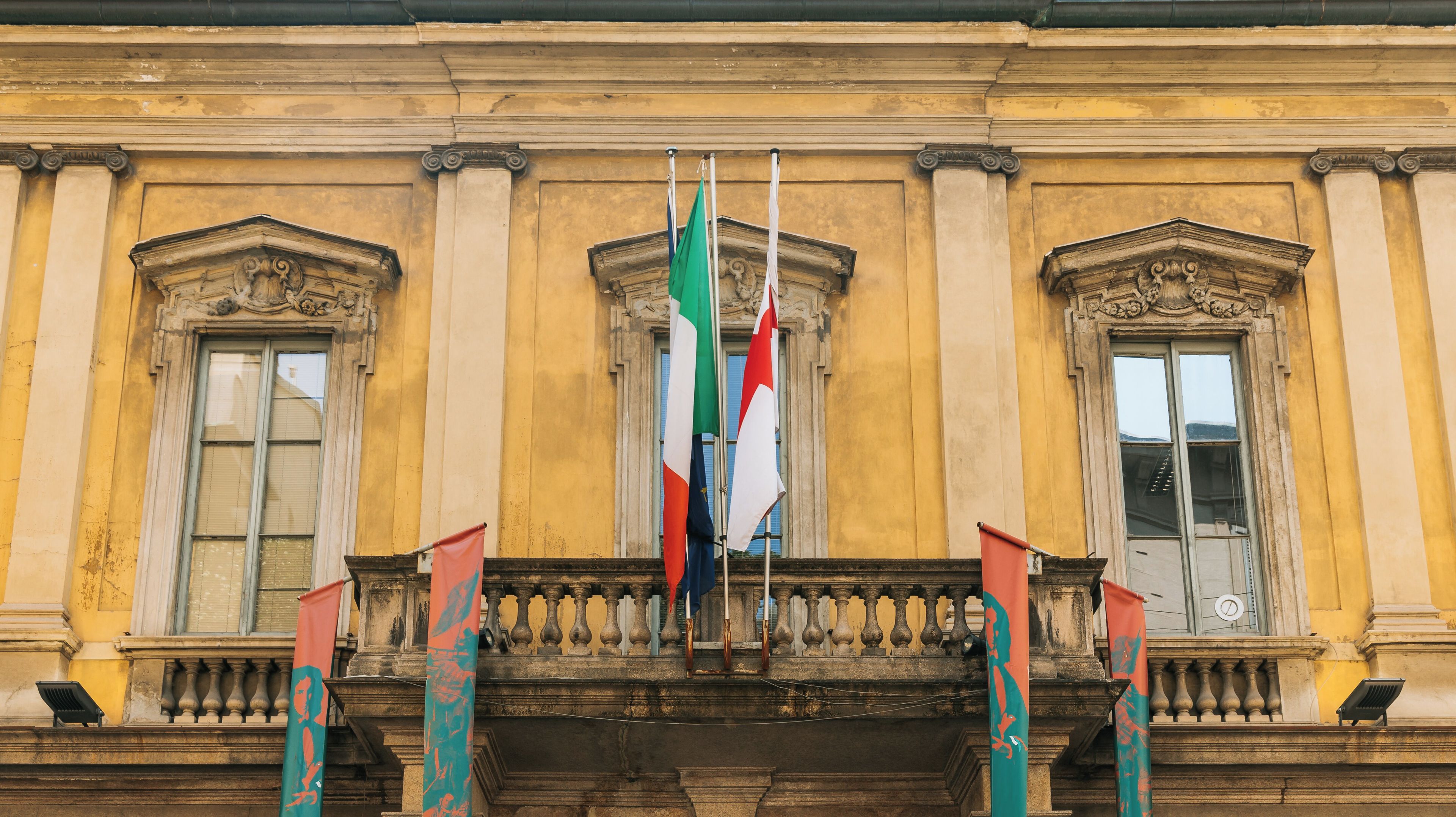 A building facade with classical architecture, including columns and decorative moldings.