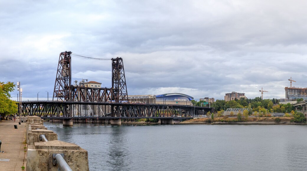 Steel bridge over Willamette river with Portland skyline