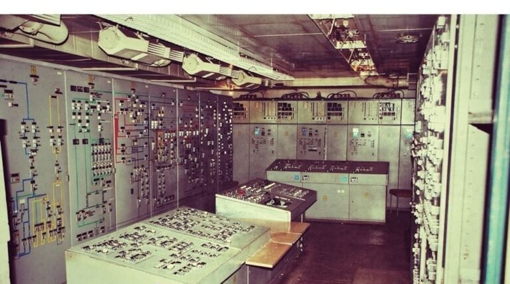 Bunker 5001 was East Germanyâs ultimate undisclosed location. Had the Cold War turned hot, East German leader Erich Honecker and other high-ranking communist leaders would have comfortably ridden out the end of the world in this 7,500 cubic meter space.
Itâs buried in the middle of a forest about 40 kilometers from Berlin.
My guide, Hannes Hensel, whoâs part of a group called the Berlin Bunker Network, showed up and poked around the ground for awhile until he uncovers a steel trapdoor. He opens it and beckons me inside. We wonât surface again for well over 4 hours.
âThis was the most technologically advanced bunker of its time,â Hensel says while explaining his interest in the site. Bunker 5001 was actually superior in some respects to similar American and West German bunkers of its time.
Inside, he shows me how the East Germans built the bunker as a series of massive containers, built on giant springs and coils so that the facility could ride out the shock wave from nearby nuclear blasts. The bunker contained its own generators, water system and air filtering facilities, so that its 400 inhabitants would have had no need to enter the nuclear wasteland above for two weeks after a war. The postwar plans were a bit hazier, however.
âAfter two weeks, they would have gone above ground wearing radiation suits and gotten to an airplane and flown eastward to Russia,â says Hensel.
Bunker 5001 is definitely number one on the most endangered list of bunkers in the Berlin area. The siteâs entrances meanwhile IS SEALED UP with concrete sometime to prevent thrill-seekers from gaining access.
Further Documentation is available at http://www.bunker5001.com/