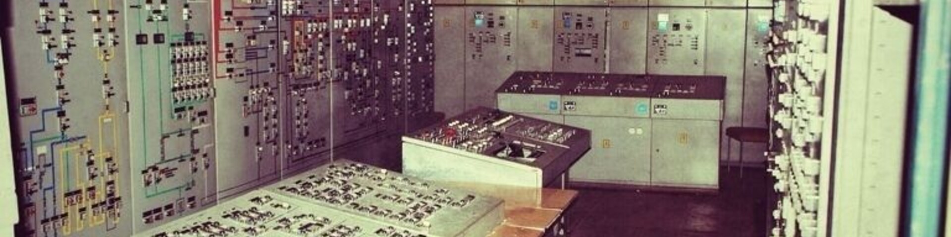 Bunker 5001 was East Germany’s ultimate undisclosed location. Had the Cold War turned hot, East German leader Erich Honecker and other high-ranking communist leaders would have comfortably ridden out the end of the world in this 7,500 cubic meter space.
It’s buried in the middle of a forest about 40 kilometers from Berlin.
My guide, Hannes Hensel, who’s part of a group called the Berlin Bunker Network, showed up and poked around the ground for awhile until he uncovers a steel trapdoor. He opens it and beckons me inside. We won’t surface again for well over 4 hours.
“This was the most technologically advanced bunker of its time,” Hensel says while explaining his interest in the site. Bunker 5001 was actually superior in some respects to similar American and West German bunkers of its time.
Inside, he shows me how the East Germans built the bunker as a series of massive containers, built on giant springs and coils so that the facility could ride out the shock wave from nearby nuclear blasts. The bunker contained its own generators, water system and air filtering facilities, so that its 400 inhabitants would have had no need to enter the nuclear wasteland above for two weeks after a war. The postwar plans were a bit hazier, however.
“After two weeks, they would have gone above ground wearing radiation suits and gotten to an airplane and flown eastward to Russia,” says Hensel.
Bunker 5001 is definitely number one on the most endangered list of bunkers in the Berlin area. The site’s entrances meanwhile IS SEALED UP with concrete sometime to prevent thrill-seekers from gaining access.
Further Documentation is available at http://www.bunker5001.com/