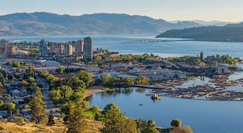 Kelowna British Columbia skyline and Okanagan Lake with the R W Bennett Bridge from Knox Mountain at sunset