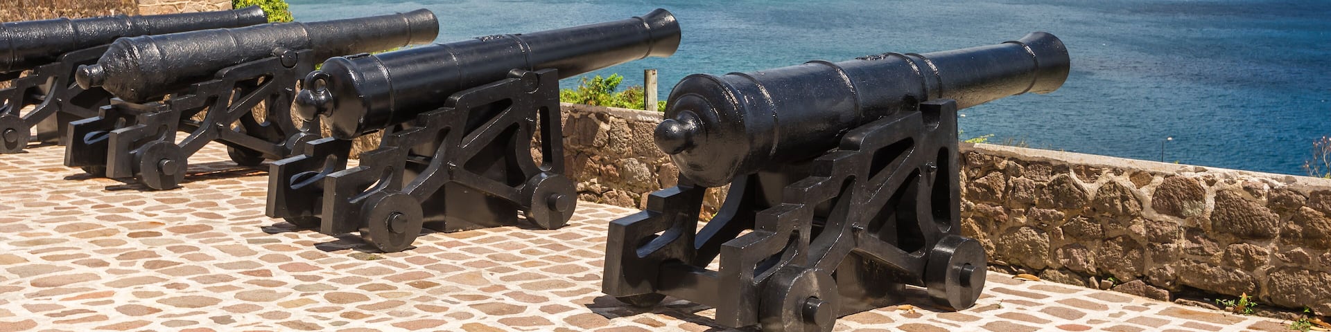 A row of cannons at Fort Shirley in Cabrits National Park near Portsmouth on the Caribbean island nation of Dominica