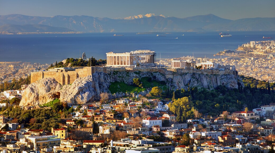Aerial view over Athens with te Acropolis and harbour from Lycabettus hill, Greece at sunrise