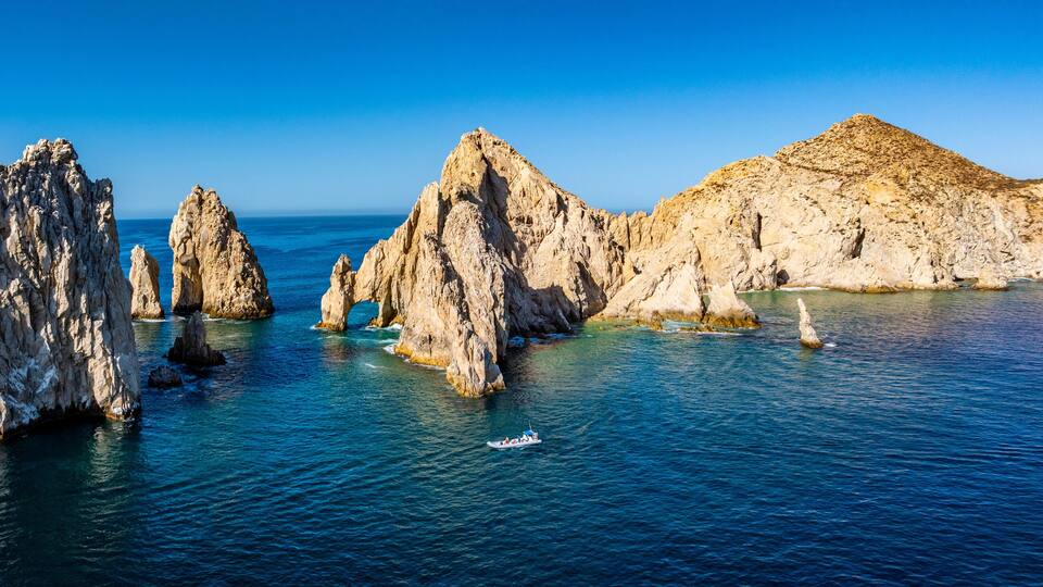 El Arco de Cabo San Lucas, Baja California Sur, Mexico, panoramic aerial view of Lands End, the southernmost tip of the Baja California peninsula, located in the Pacific Ocean - with 1 tourist boat