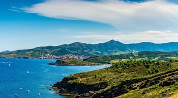 Steep coast of Roussillon, and in the background the village of Banyuls sur mer, in French Catalonia in Occitanie, France