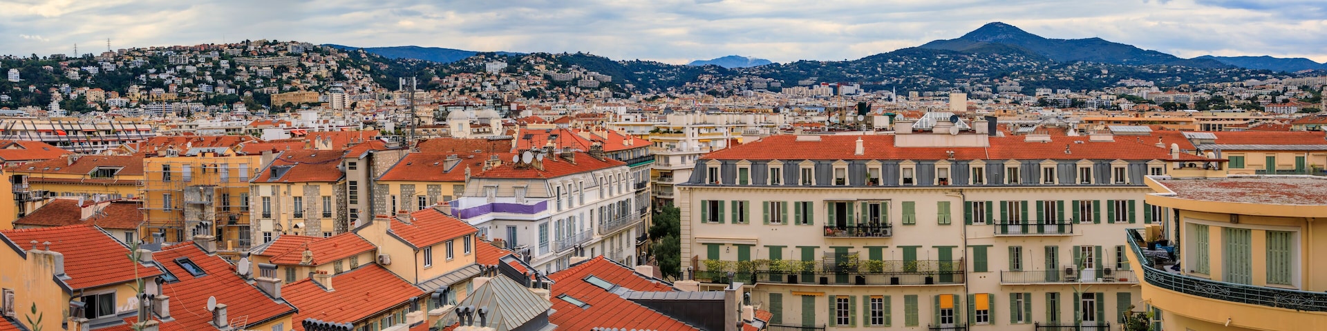 Aerial view of the bourgeois buildings and terracotta rooftops of the Carre d'Or Golden Square chic seafront district in Nice, South of France