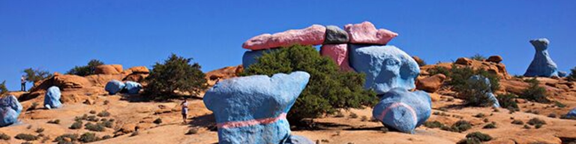 4 km outside of Tafraoute, the Belgian painter Jean Veran have made his stunning art project. The painted stone formations come as a surprise to you and are a contrast to the landscapes own golden red colors. Jean Veran helps you to experience the beauty of the landscape in a new, and for my part, stronger way. Some places the whole mountain is painted in blue. My personal opinion is that his artistic expression is strongest when he is limited to only paint single stones and restricted areas. Restricting himself makes the art more obviously and the contrast to nature is more exciting. Read more at: http://www.travelwithallsenses.com/land-art-tafraoute-morocco/