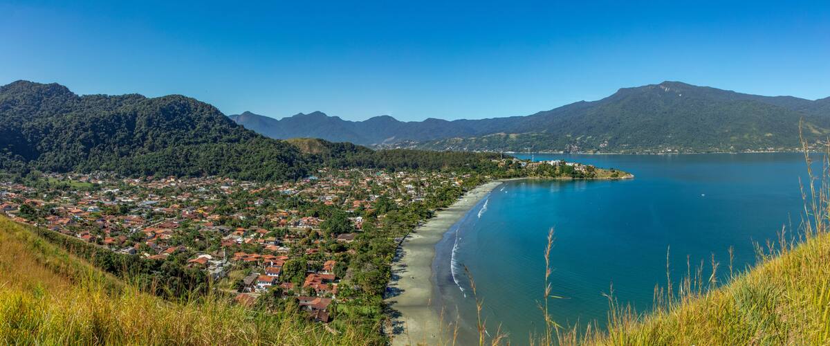 Beautiful panoramic view of Ilhabela island and coast of Sao Sebastiao, tropical island on the Brazilian sea coast during a sunny day of vacation and sightseeing.
