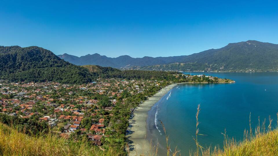 Beautiful panoramic view of Ilhabela island and coast of Sao Sebastiao, tropical island on the Brazilian sea coast during a sunny day of vacation and sightseeing.