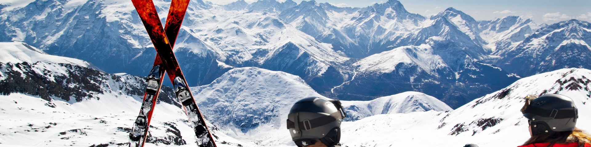 Young happy couple lying in snowy mountains