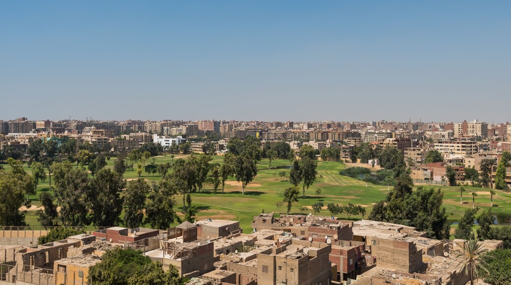 Aerial view of Cairo of red brick houses from the Giza pyramid complex, the Giza Necropolis, on the Giza Plateau in Greater Cairo, Egypt