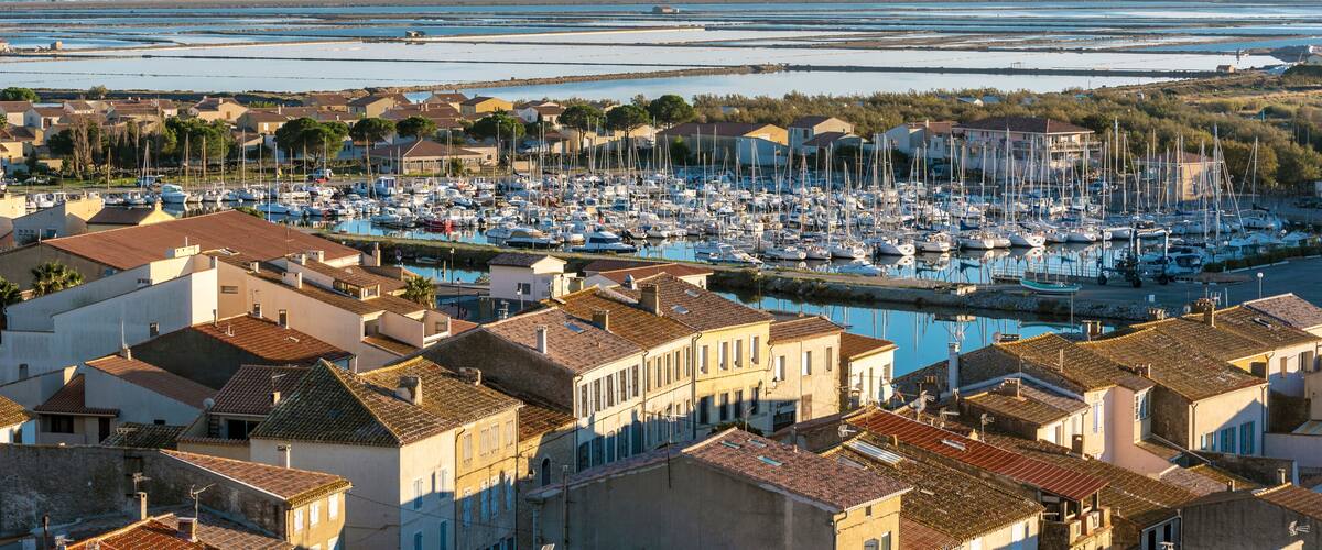 Marina of Gruissan town, Grazel Pond ant Mediterranean coastline as seen from Barberousse Tower. Occitanie, France.