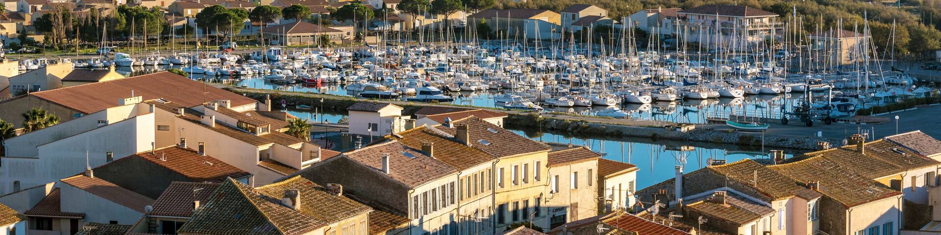 Marina of Gruissan town, Grazel Pond ant Mediterranean coastline as seen from Barberousse Tower. Occitanie, France.