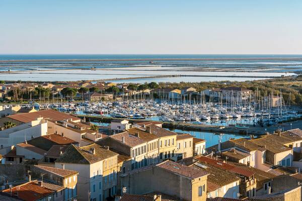 Marina of Gruissan town, Grazel Pond ant Mediterranean coastline as seen from Barberousse Tower. Occitanie, France.