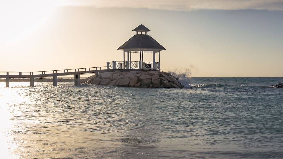 Oceanside Gazeebo Sunset Beach with Lifeguard Chair and Wind Flag