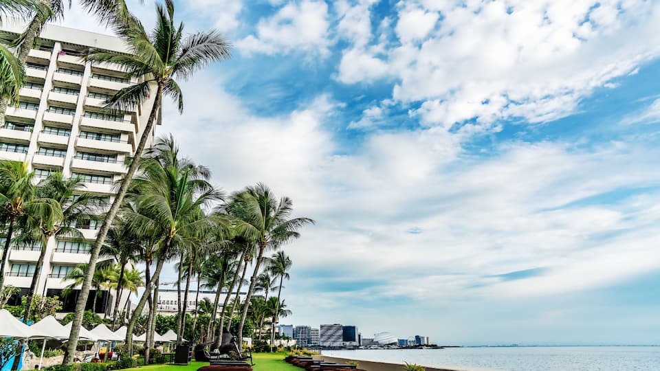Blue skies along the coast of Pasay over the Manila Bay in the Philippines.