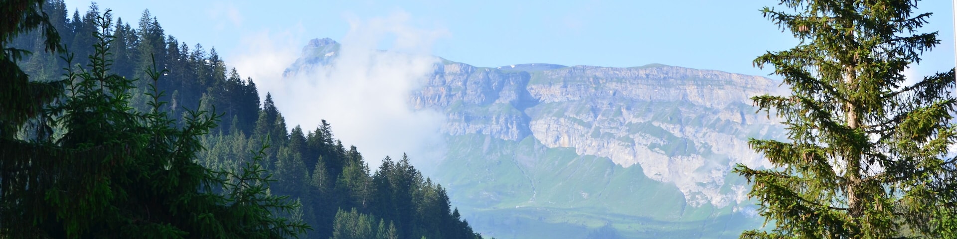 Panoramic view of rock wall at horizon in Swiss Alps