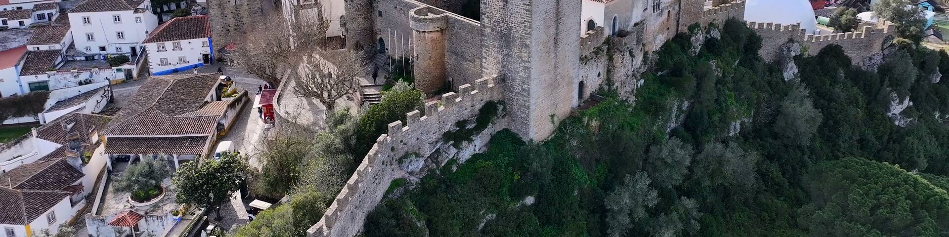 Obidos Castle In Obidos Leiria Portugal. Aerial View Of Landmark Medieval Building In Downtown Scene. Business Clouds Sky Downtown Cityscape. Backgrounds Panoramic. Obidos Leiria.