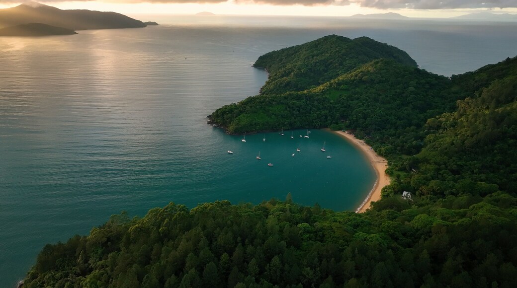 Aerial view of lush tropical archipelago with islands and sailboats at sunrise, Parque Das Palmeiras, Angra dos Reis, Rio de Janeiro, Brazil.