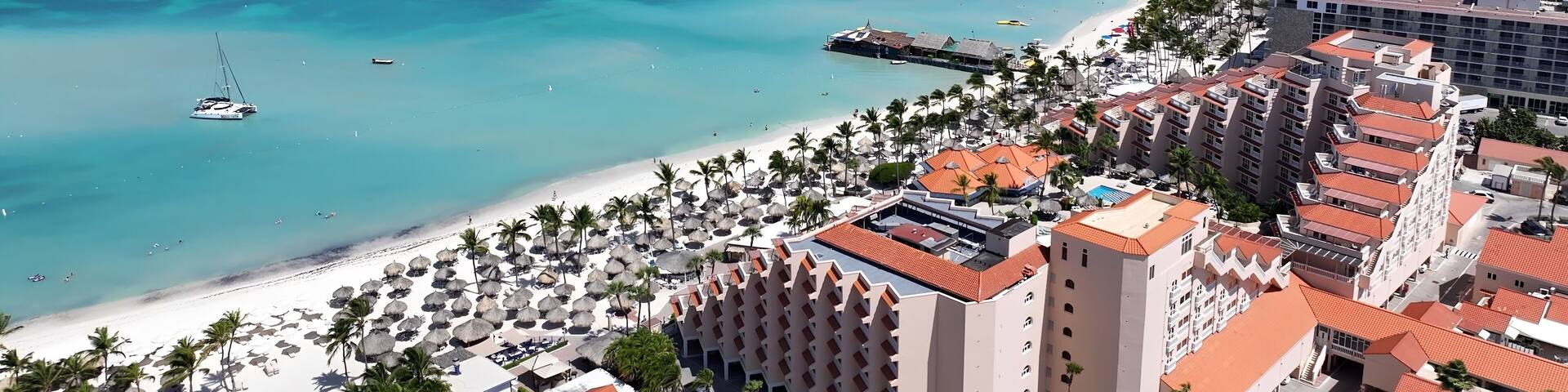 Palm Beach In Noord Oranjestad Aruba. Stunning Tropical Coastline Beach Scene Viewed From Above. Paradise Skyline Grateful Vibrant. Paradise Sea. Noord Oranjestad.
