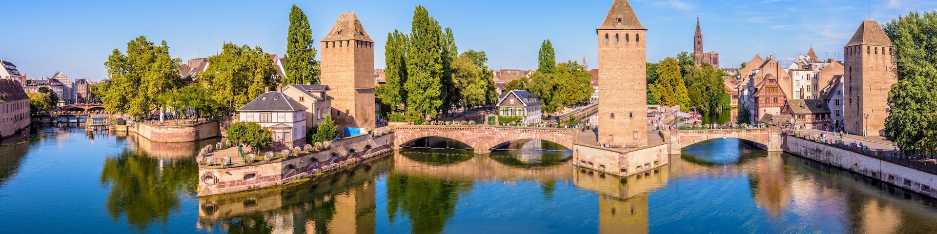 Panoramic view of the Ponts Couverts (covered bridges), a medieval set of bridges and defensive towers on the river Ill at the entrance of the Petite France historic quarter in Strasbourg, France.