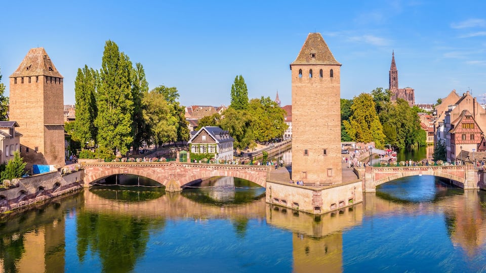 Panoramic view of the Ponts Couverts (covered bridges), a medieval set of bridges and defensive towers on the river Ill at the entrance of the Petite France historic quarter in Strasbourg, France.