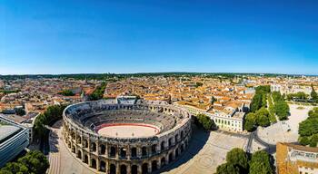The aerial view of Arena of Nîmes, an old Roman city in the Occitanie region of southern France