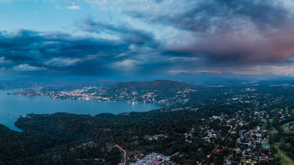 High altitude aerial photography with the drone of Valle de Bravo lake at sunset from Avandaro
