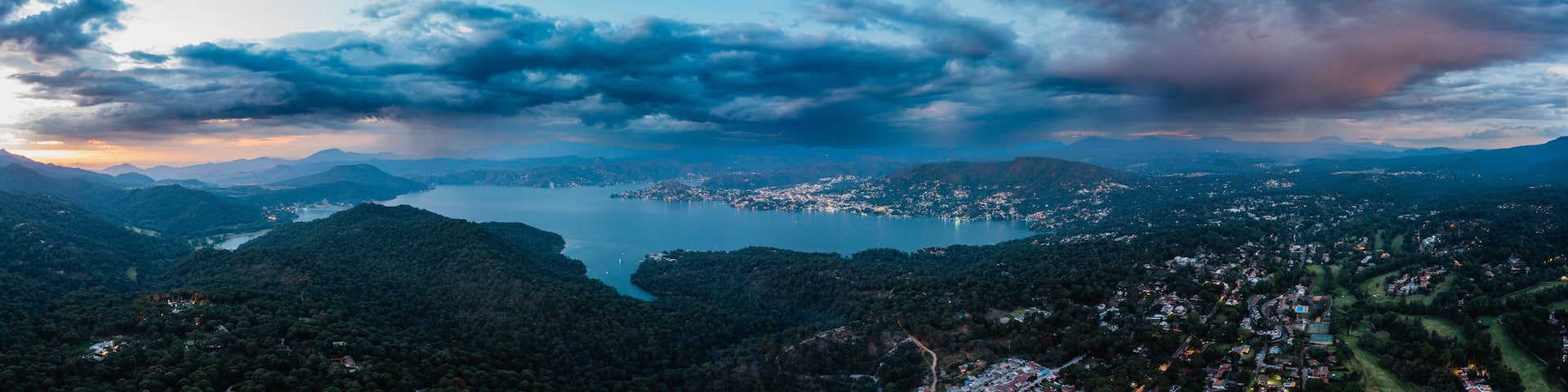 High altitude aerial photography with the drone of Valle de Bravo lake at sunset from Avandaro