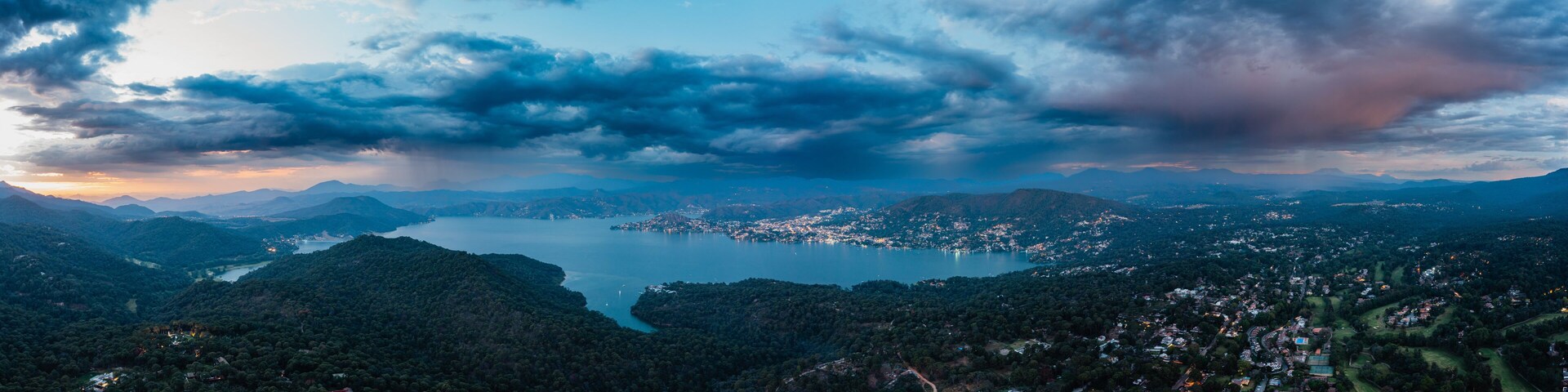 High altitude aerial photography with the drone of Valle de Bravo lake at sunset from Avandaro