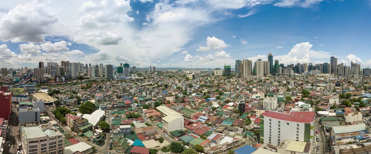 Full panorama of Metro Manila cityscape. 3 major skylines are seen from left to right: Mandaluyong/Ortigas, Fort Bonifacio, and Makati.