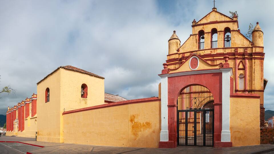 San Cristóbal Cathedral Panorama, Central Park, San Cristobal de las Casas, Mexico. The Cathedral is the symbol of the City's colonial architecture. It's facade colorful facade has Baroque influences.