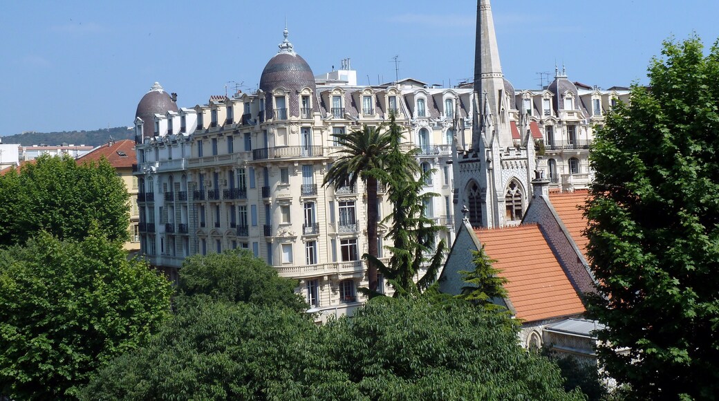 The spire of protestant church in Nice. In the background Hotel La Villa Victor Hugo, Boulevard Victor Hugo.