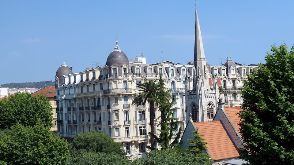The spire of protestant church in Nice. In the background Hotel La Villa Victor Hugo, Boulevard Victor Hugo.