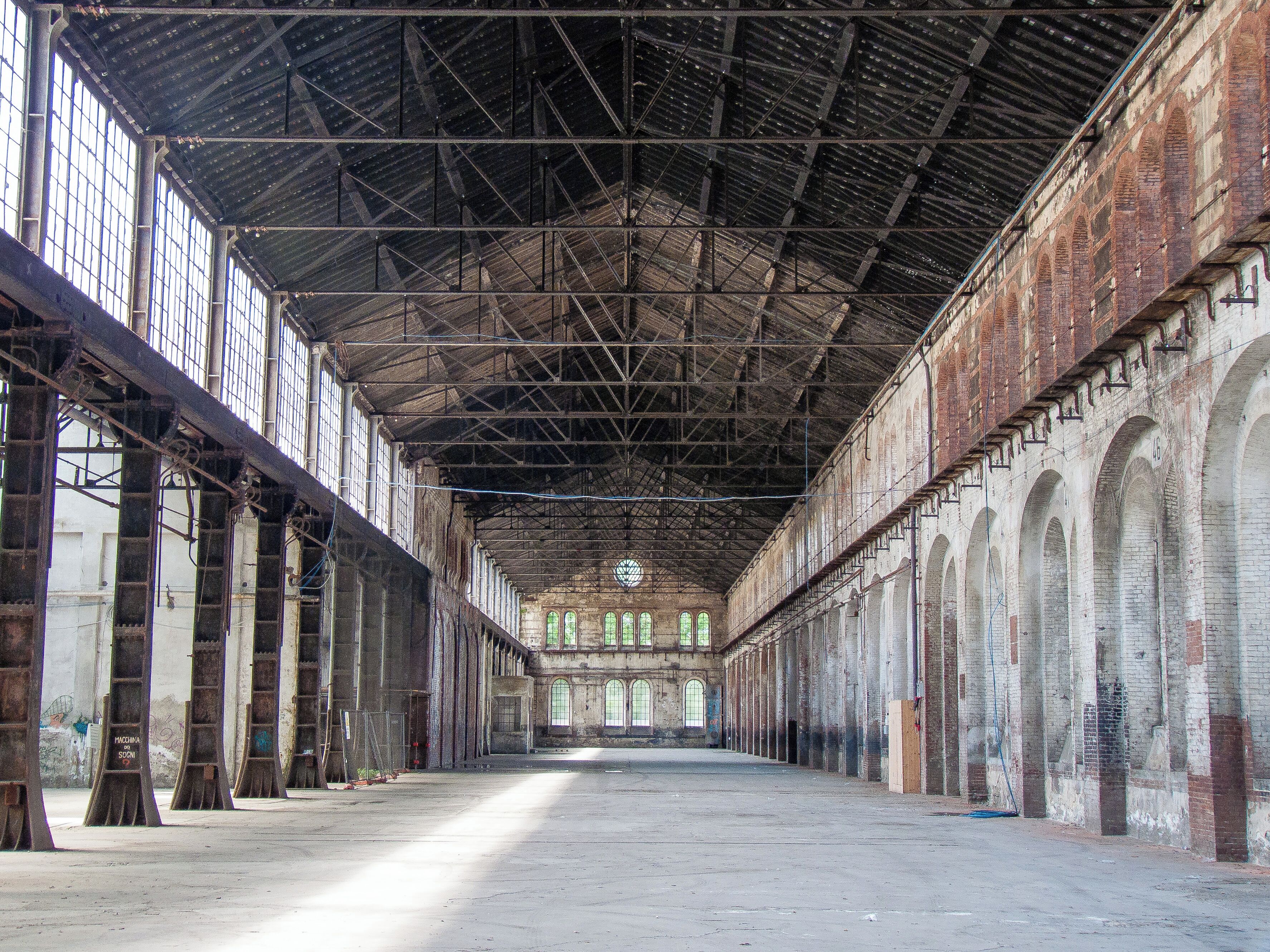 The OGR - Officine Grandi Riparazioni (Big Repair Shops) are one of the last vestiges of Turin's industrial past. Built between 1885 and 1895, they became the first engine of development of the San Paolo neighborhood. Stretching over an area of more than 190,000 square meters, the buildings were used to build and repair locomotives and carriages. The H-shaped complex is a work of great architectural and monumental impact. Inside two rows of cast iron pillars create a spectacular nave and aisle structure, a true "industry cathedral". Abandoned for many years, the OGR are now the object of an architectural and functional restoration which aims to transform the complex into a large exhibit centre.