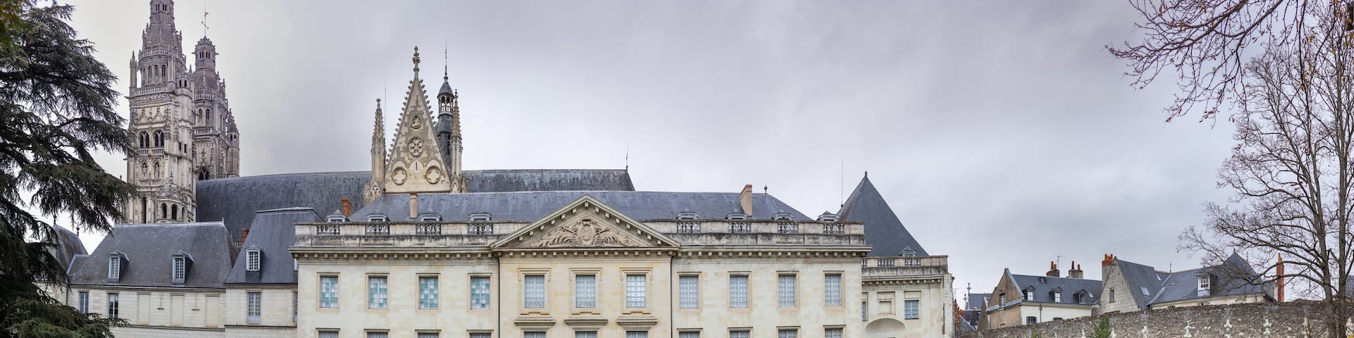 Museum of Fine Arts and garden with majestic lebanese cedar which more than bicentenary. Gothic towers of Cathedrale Saint-Gatien on background.