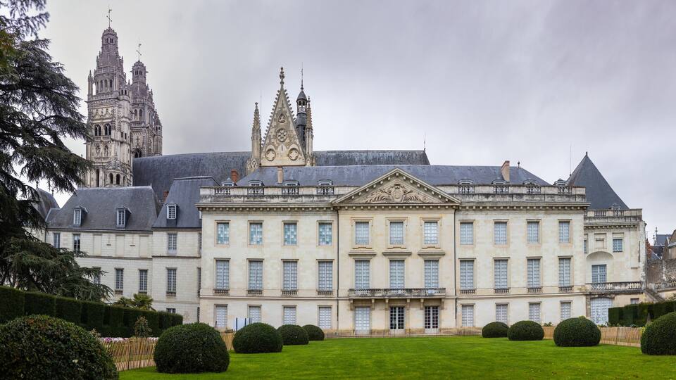 Museum of Fine Arts and garden with majestic lebanese cedar which more than bicentenary. Gothic towers of Cathedrale Saint-Gatien on background.