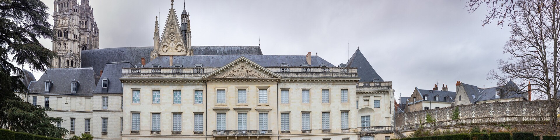 Museum of Fine Arts and garden with majestic lebanese cedar which more than bicentenary. Gothic towers of Cathedrale Saint-Gatien on background.