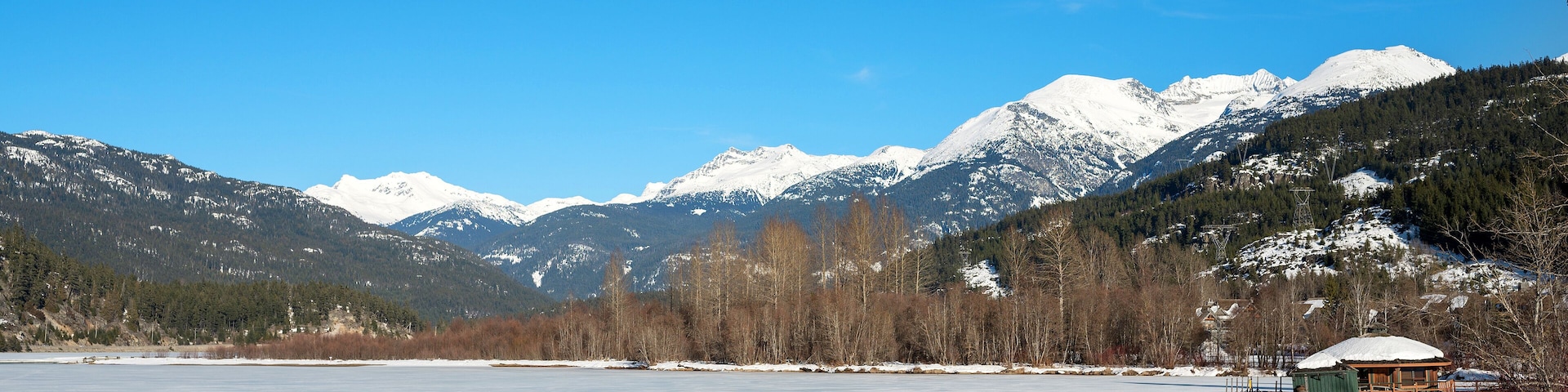A frozen mountain lake in British Columbia, Canada. Green Lake Nicklaus North Golf Course in winter. Whistler BC, Canada.