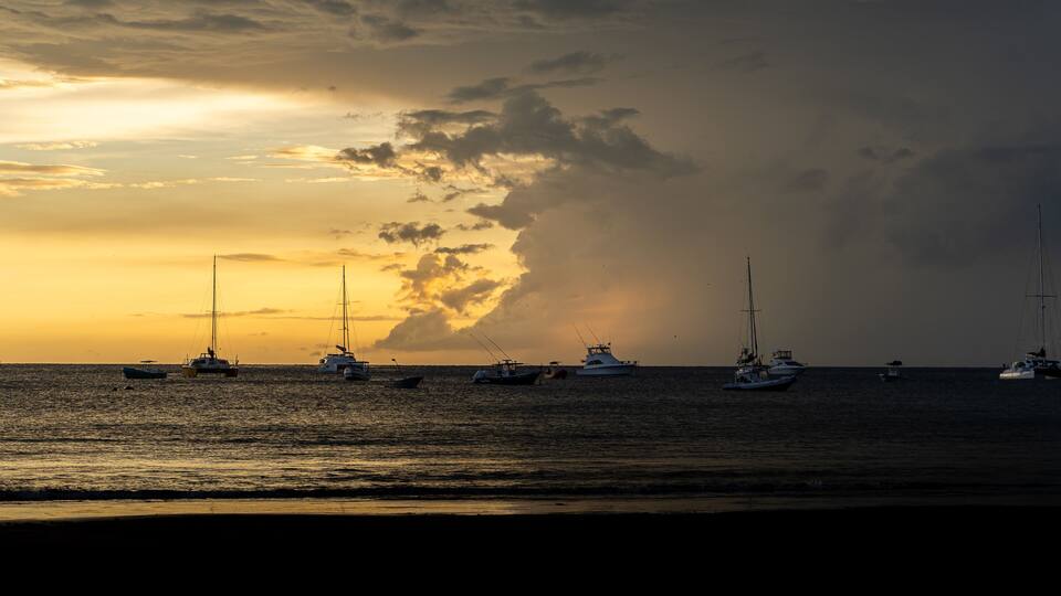Beautiful aerial view of Playas del Coco, Hermosa Beach and its green mountains, bay and yachts in Costa Rica