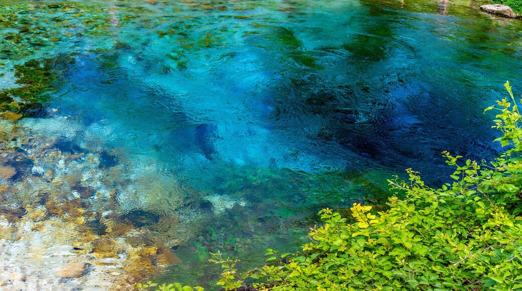 A panorama aerial view across the pool fed by the Blue eye spring in Muzine, Albania in summertime