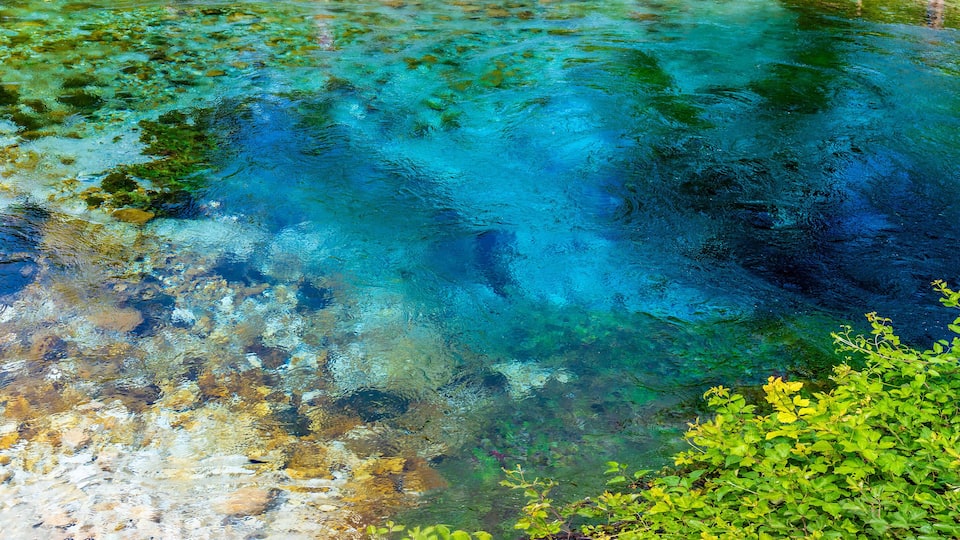 A panorama aerial view across the pool fed by the Blue eye spring in Muzine, Albania in summertime