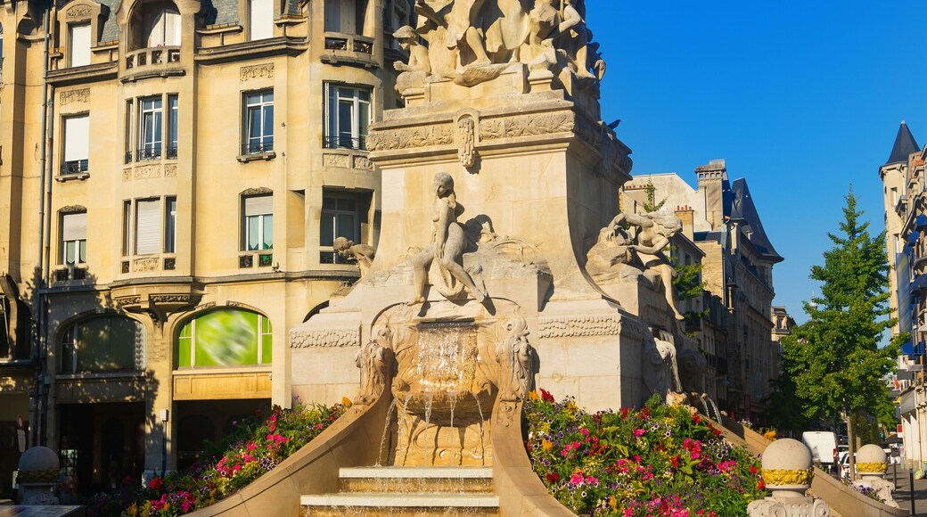 Beautiful sky and fountain Sube with golden angel at Reims central Erlon square in city center, Reims. France